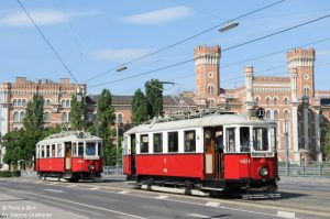 The vintage trams of Rent a Bim in front of the mighty Rossauer barracks