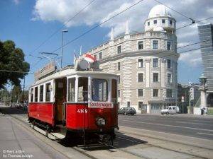 Traveling by a vintage tram in Vienna, here in front of the Urania